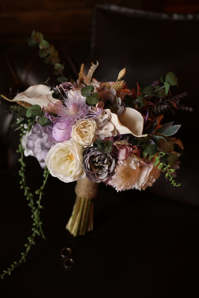 Beautiful floral bouquet featuring roses and greenery in soft pastel shades, perfect for weddings.