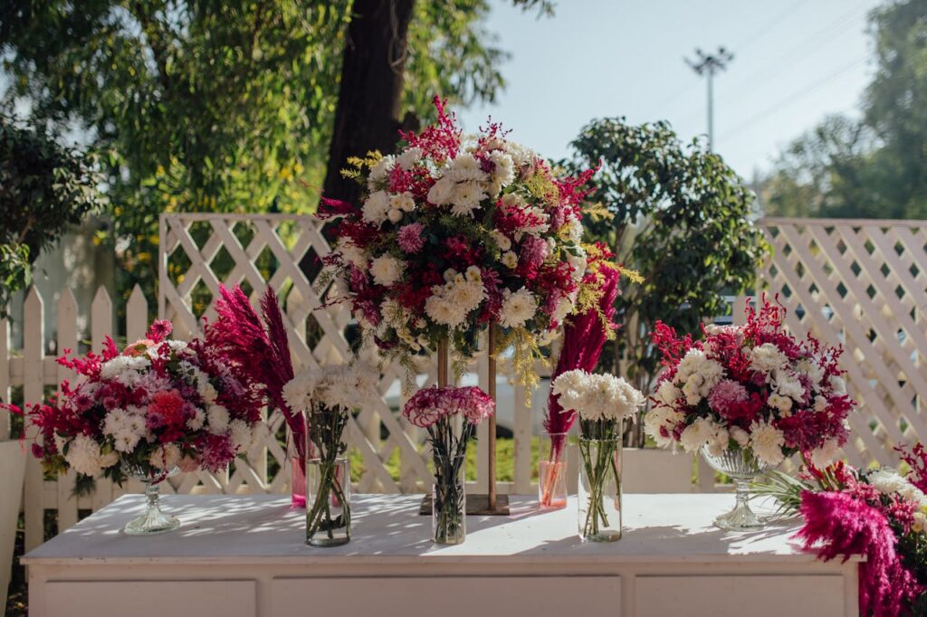 Beautiful outdoor floral arrangement with pink and white flowers on a sunny day.